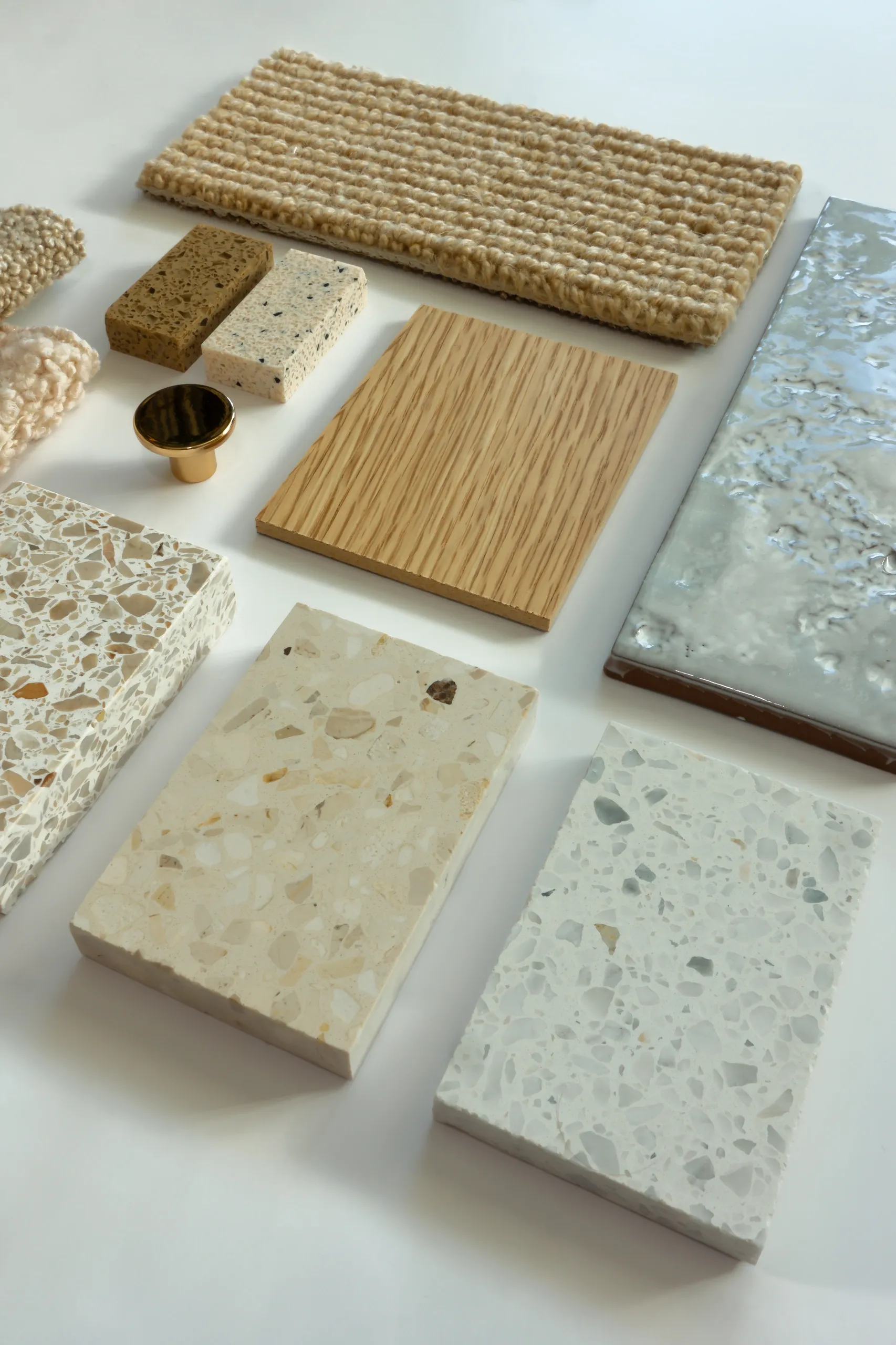 Material palette of stone, wood, and terrazzo samples