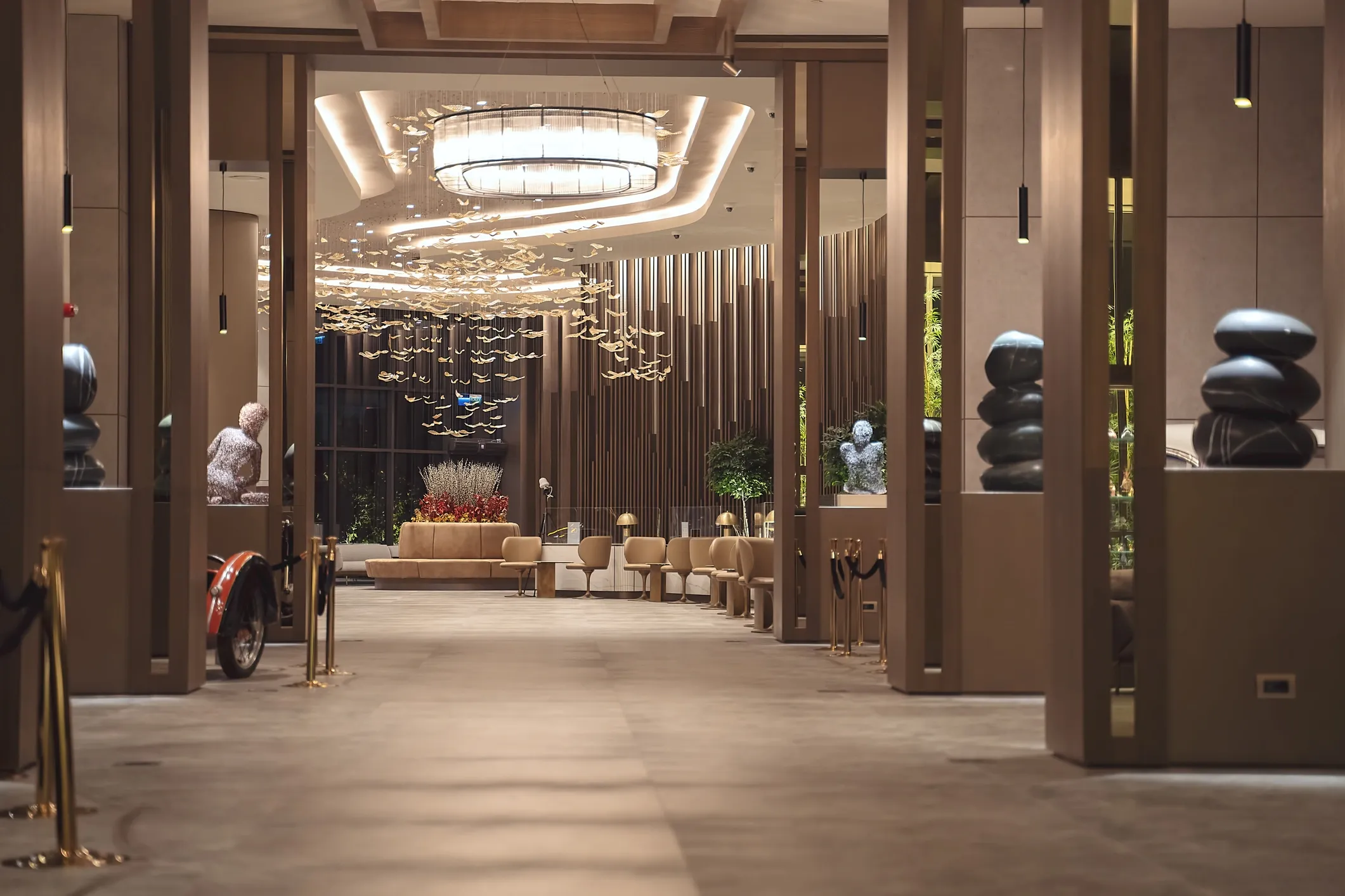 Meridian Financial headquarters corridor with sculptural gold chandelier and stone sculptures